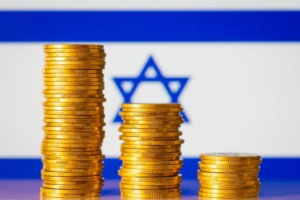מטבעות לפי גודך הרווח על רקע של דגל ישראל
